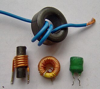 Axial through-hole inductors showing color band markings and ferrite cores
