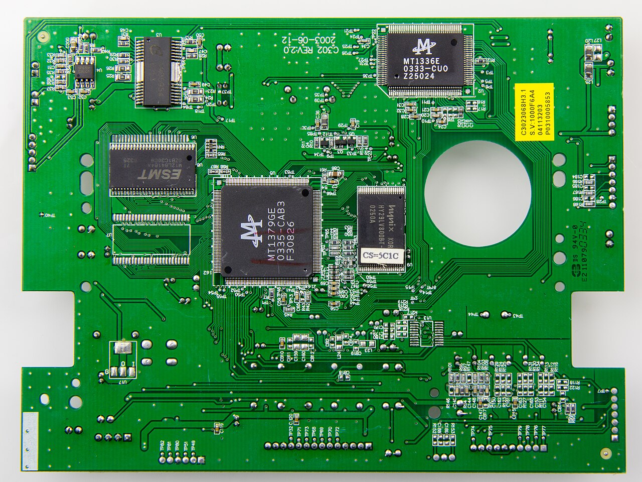 A micro-photograph showing real-world PCB trace routing, illustrating precision signal paths alongside heavy-duty power pours and planes.